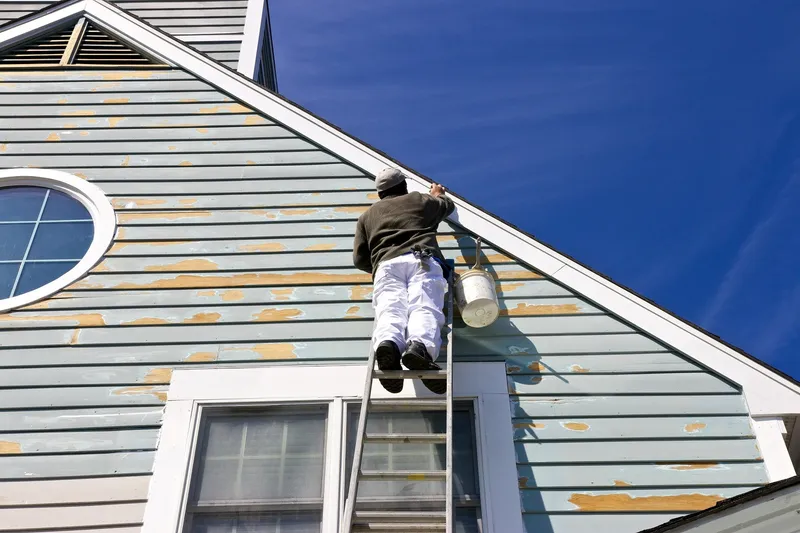 Exterior siding being repainted on an Ottawa home