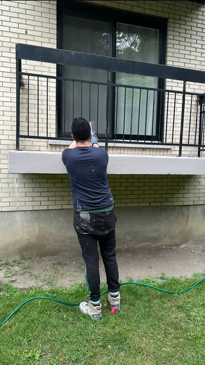 House exterior painted by Painting & Drywall Experts